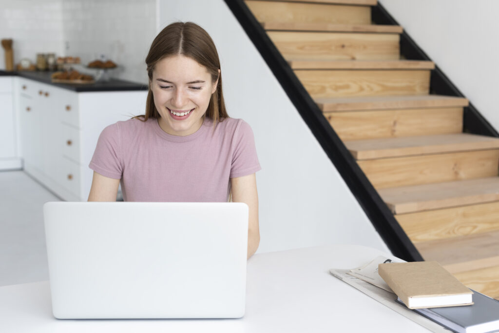smiley-woman-looking-her-laptop